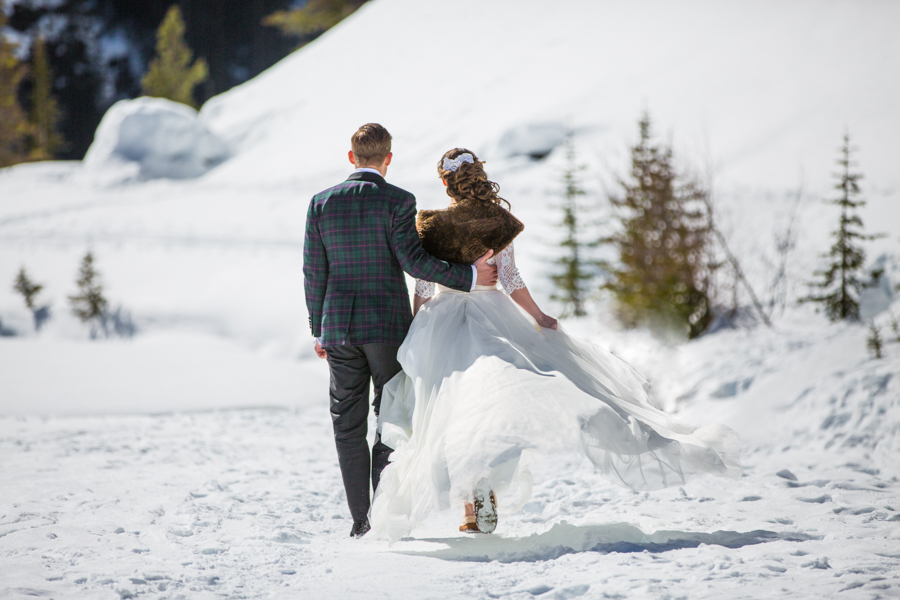 bride and groom walking at deer lodge wedding