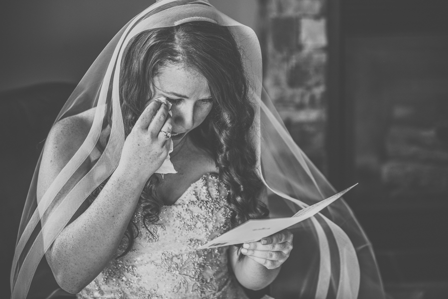 bride reading her note form her soon to be husband
