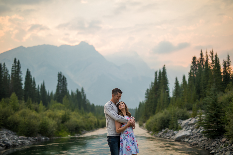 engagment session in the mountains, couple in front of a river, sunset engagement session