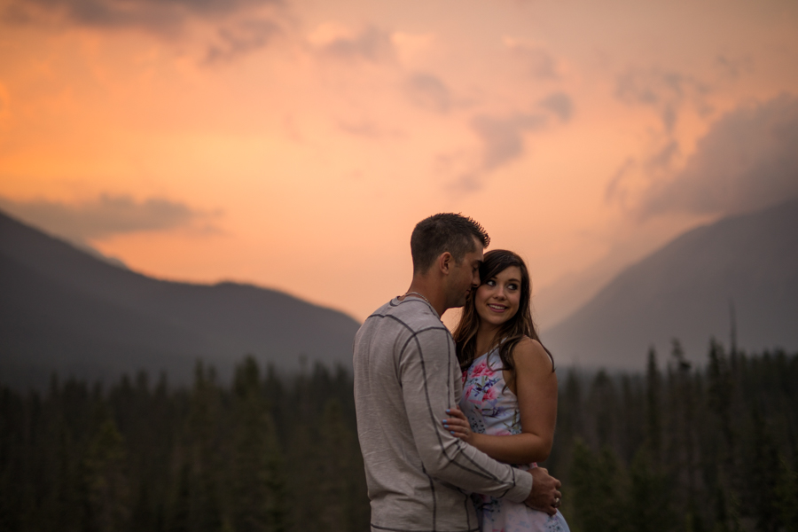 canmore engagement, canmore alberta, Alberta rocky mountains, engagement in Canmore, red sunset engagement, kisses in the ear