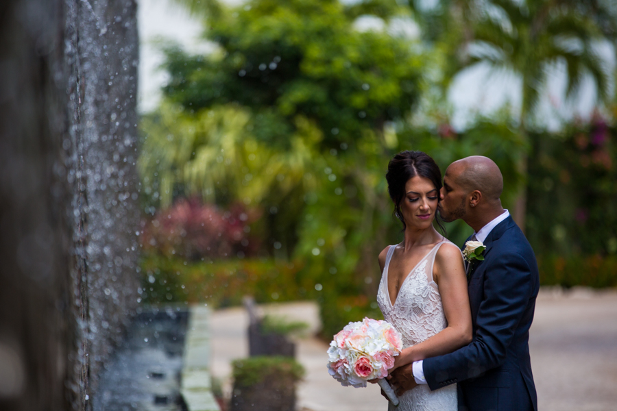 amazing destination wedding photo in front of a waterfall