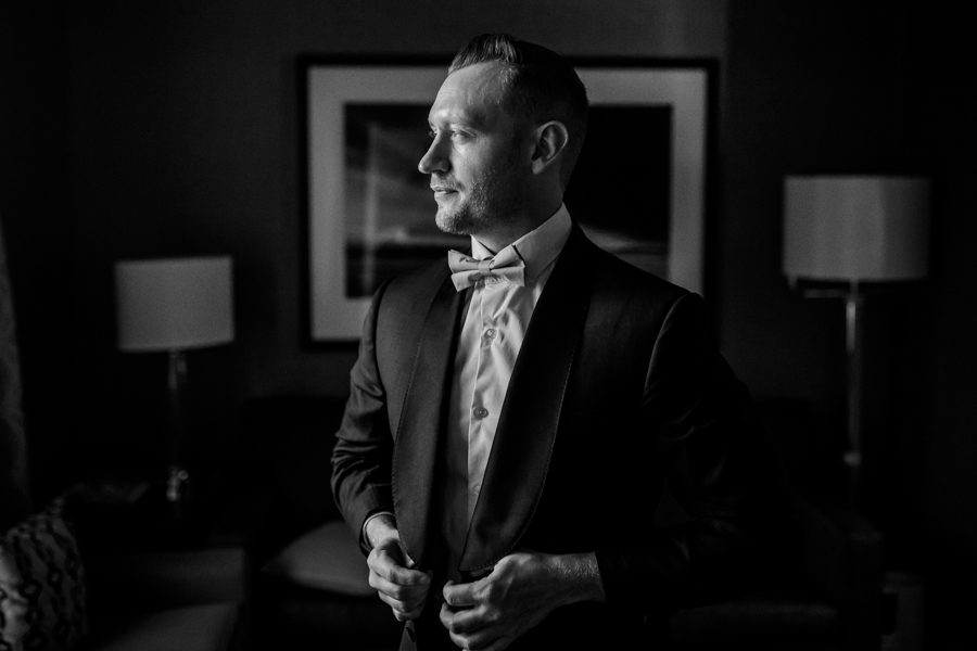 Groom getting ready at Sheraton Suites Calgary Eau Claire
