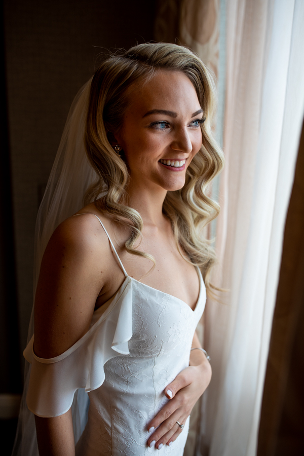 bride getting ready at Sheraton Suites Calgary Eau Claire