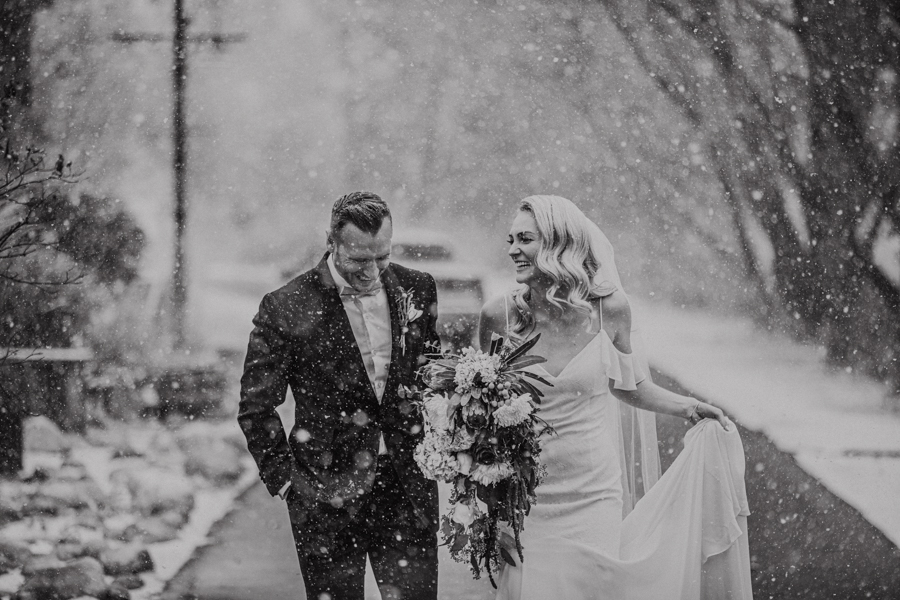 River cafe couple in the snow winter wedding gin Calgary