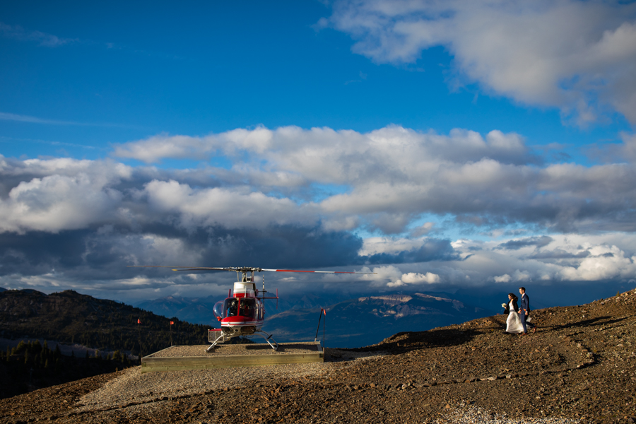 bride and groom getting in helicopter on top of eagles eye