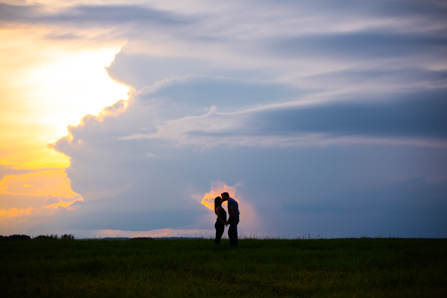 Amazing sunset with rustic country engagement session