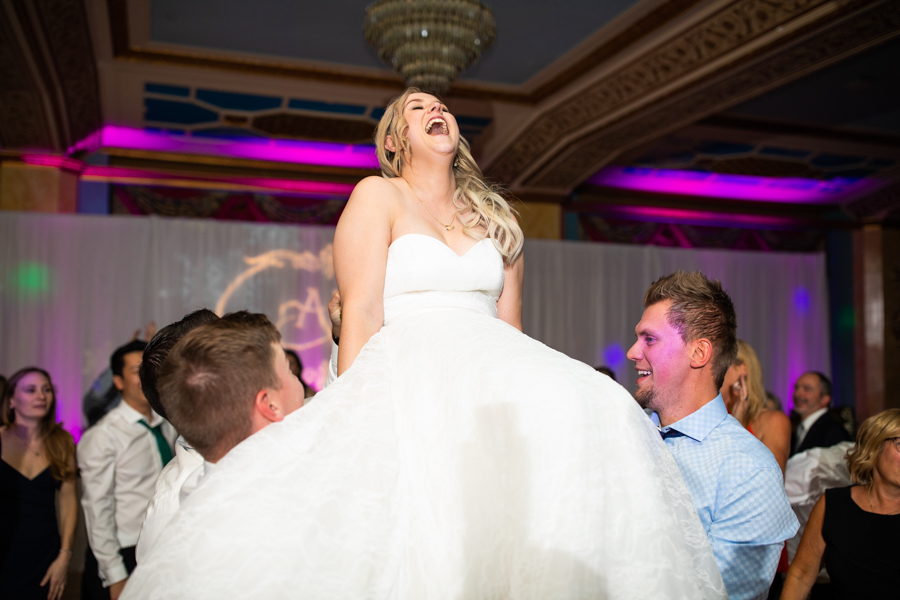 bride in a chair in the cascade ballroom