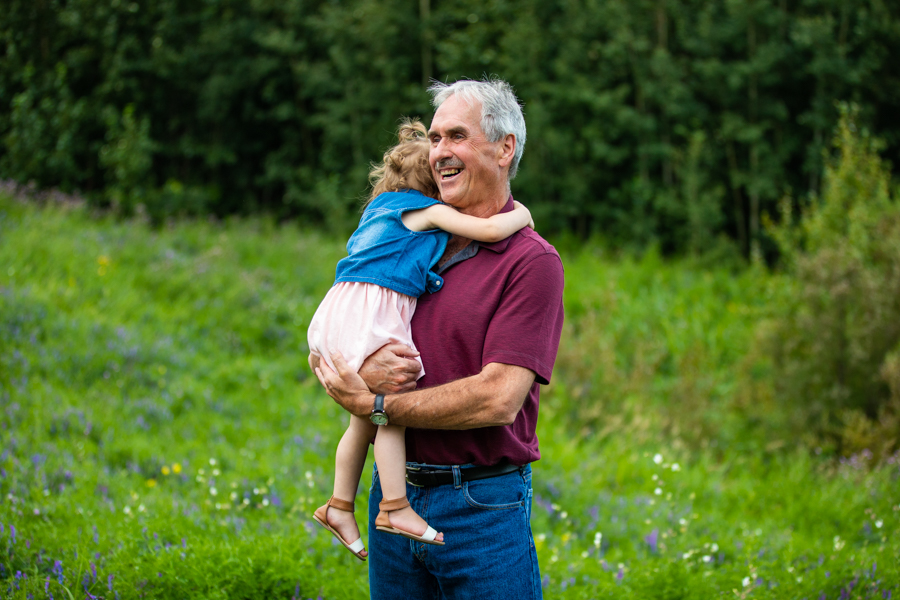 grandpa hugging granddaughter