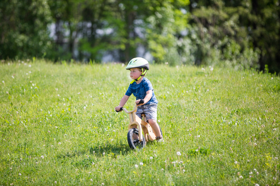 kid riding a bike eon a hill