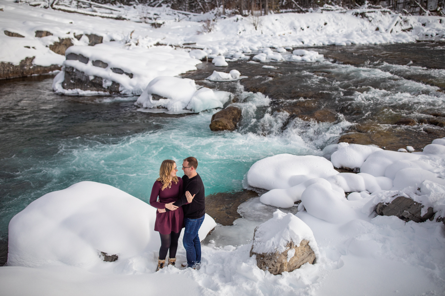 Couple picture next to a waterfall