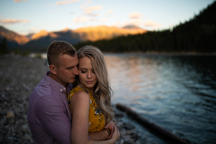 couple next to a lake in mountains