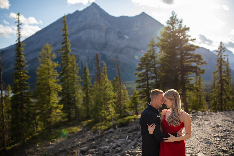 couple getting engagement photos in the mountains