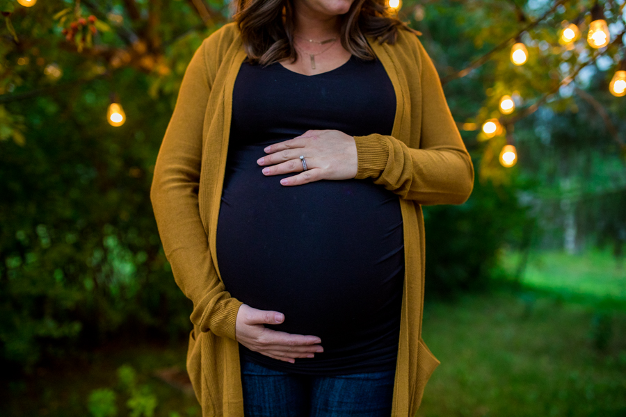 woman holding her baby bump