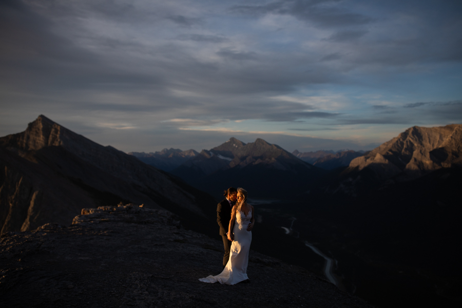 Couple on top of a mountain with a elopement photography