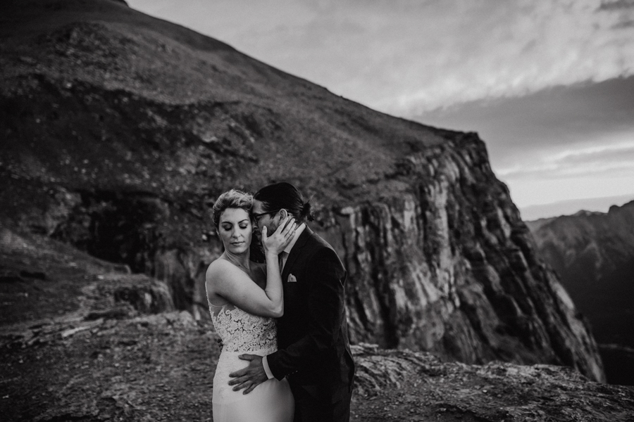 COUPLE STANDING IN THE SUNRISE