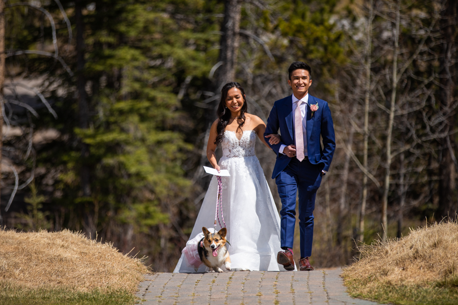 bride walking dow the isle with her brother