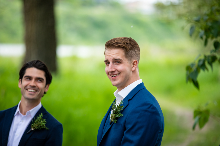 groom sees his bride for first time at fish creek ceremony site