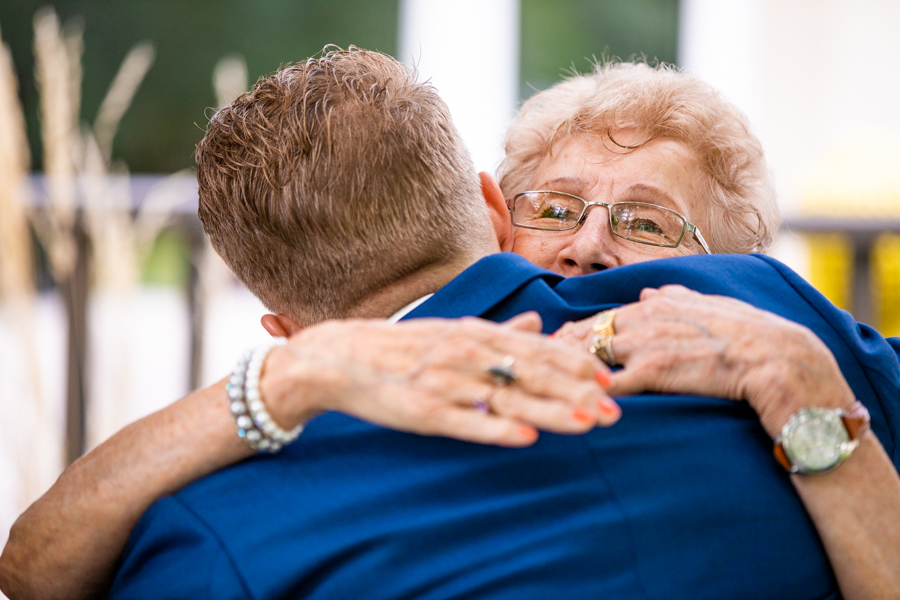 groom hugging grand mother