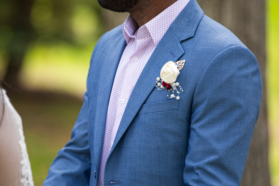 flower details on the grooms jacket