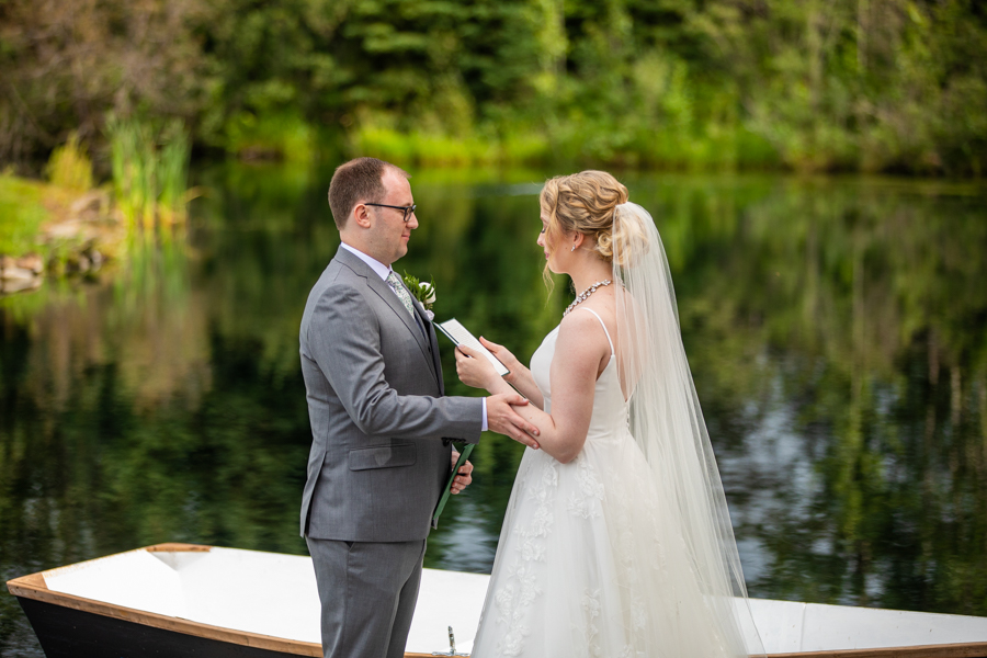 reading personal vows on a dock