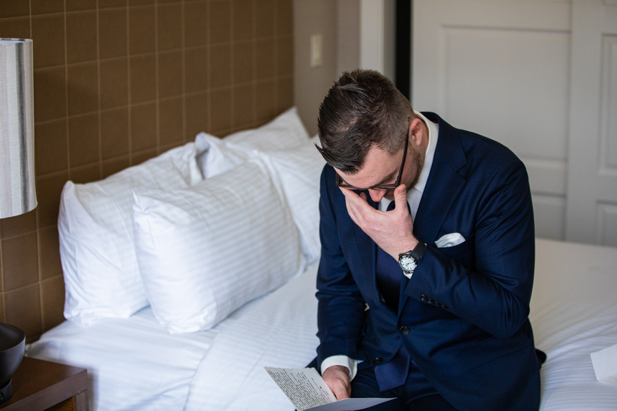 Groom getting tears at the reading