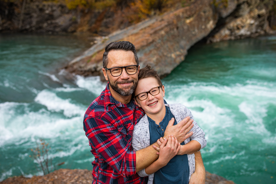 Amazing Family Photo Locations dad and son standing by a river