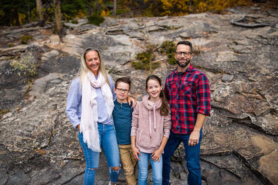 family of four in the mountains