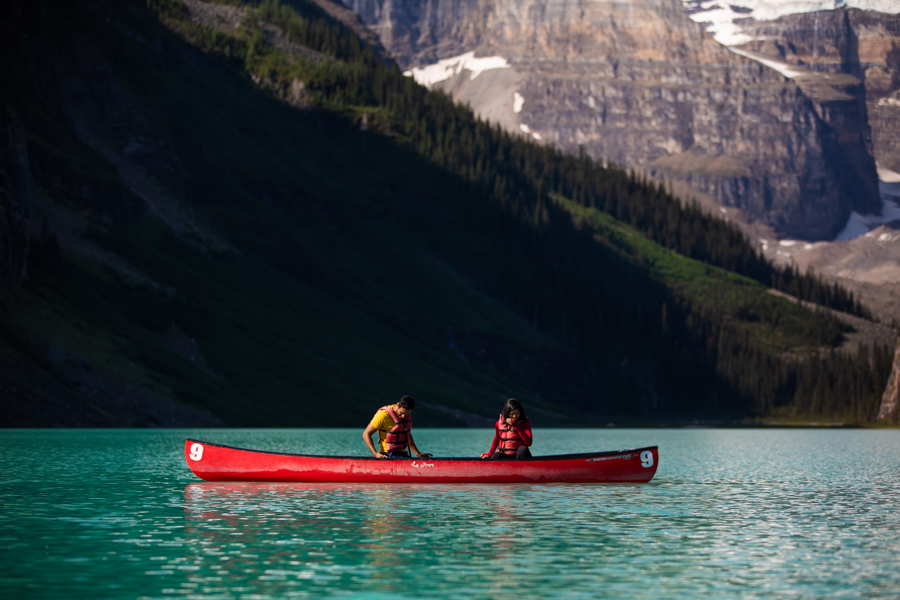 man proposing in a canoe on Lake Louise