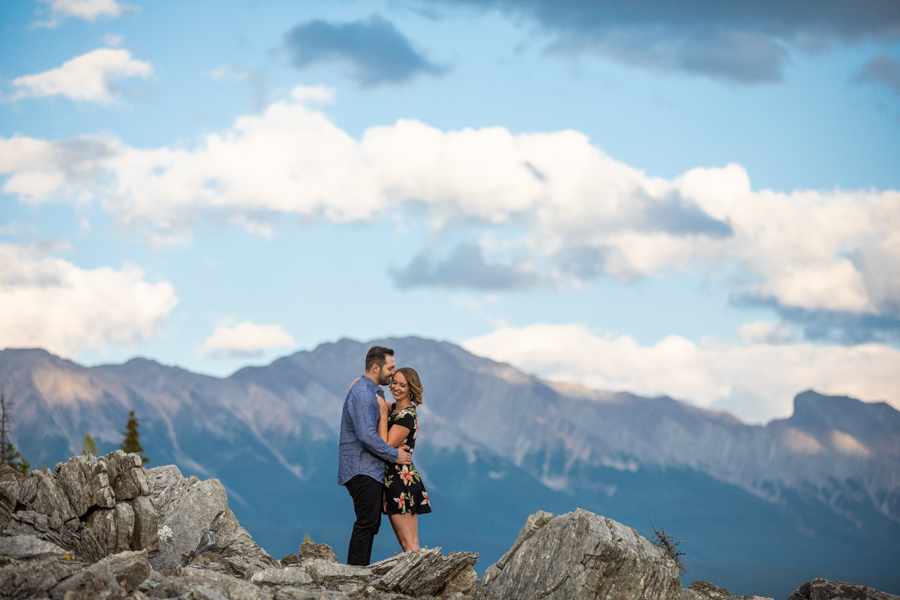 couple standing on a mountain ridge