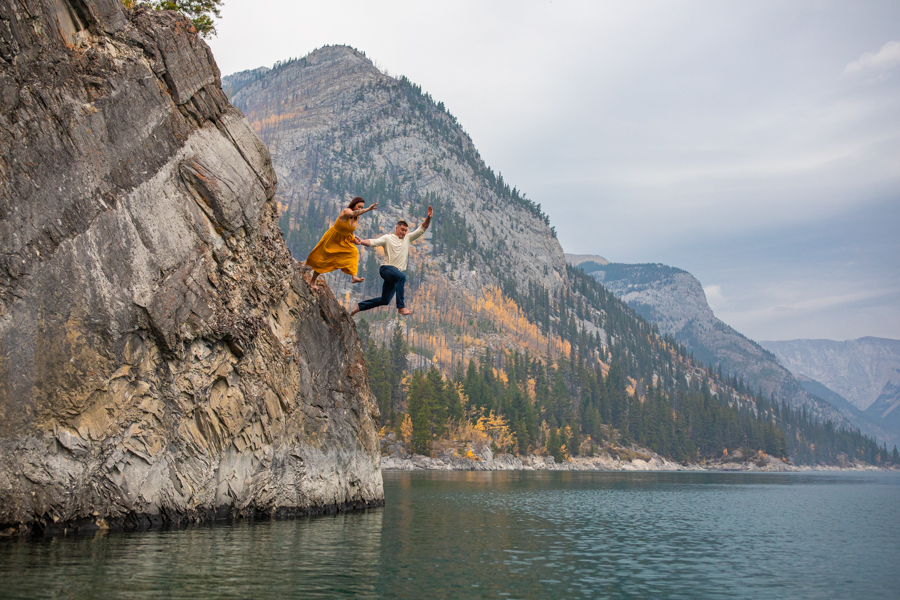 couple in the water at lake minnewanka, lake minnewanka cliff jumping couple