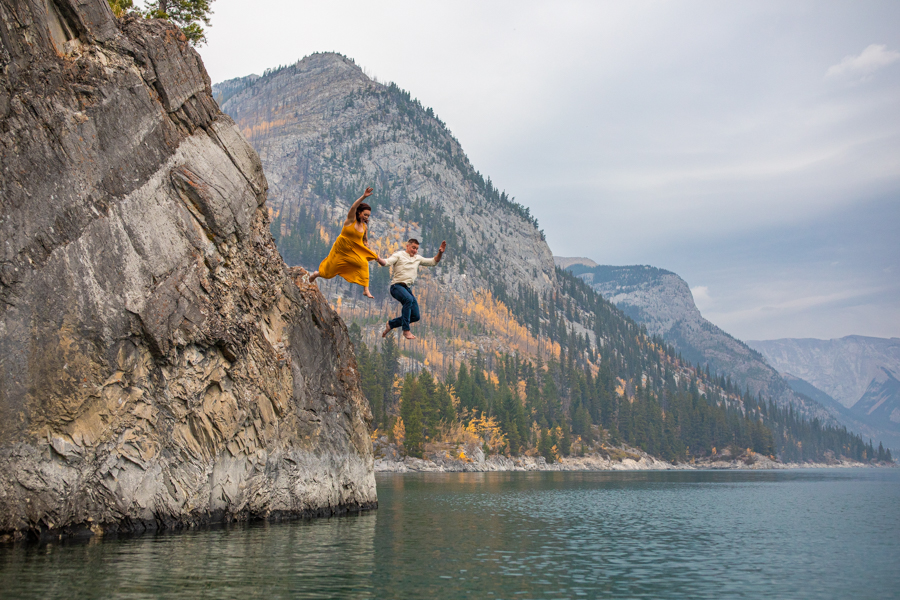 couple in the water at lake minnewanka, lake minnewanka cliff jumping couple