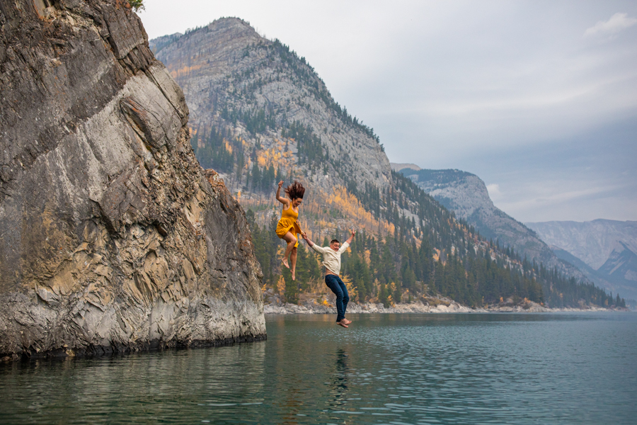 couple in the water at lake minnewanka, lake minnewanka cliff jumping couple