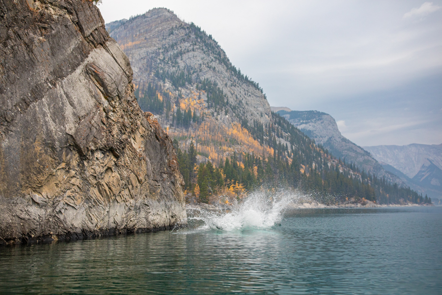 couple in the water at lake minnewanka, lake minnewanka cliff jumping couple