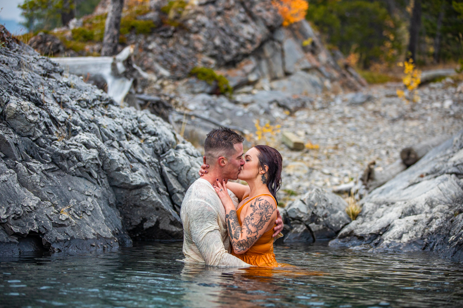 hot couple making out in the water lake minnewanka