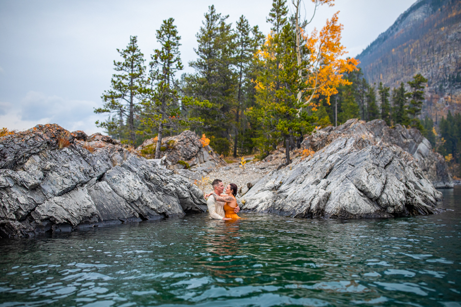hot couple making out in the water lake minnewanka