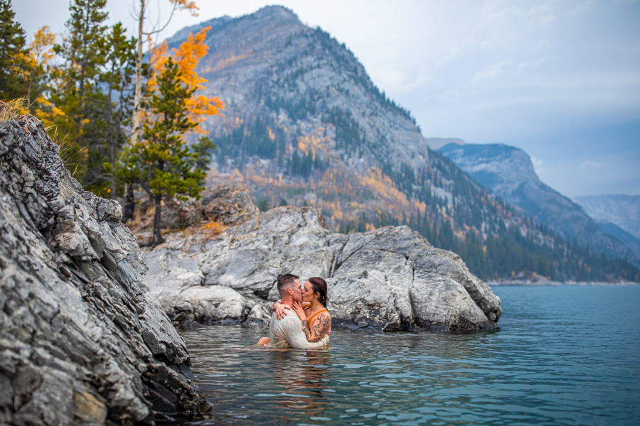 hot couple making out in the water lake minnewanka