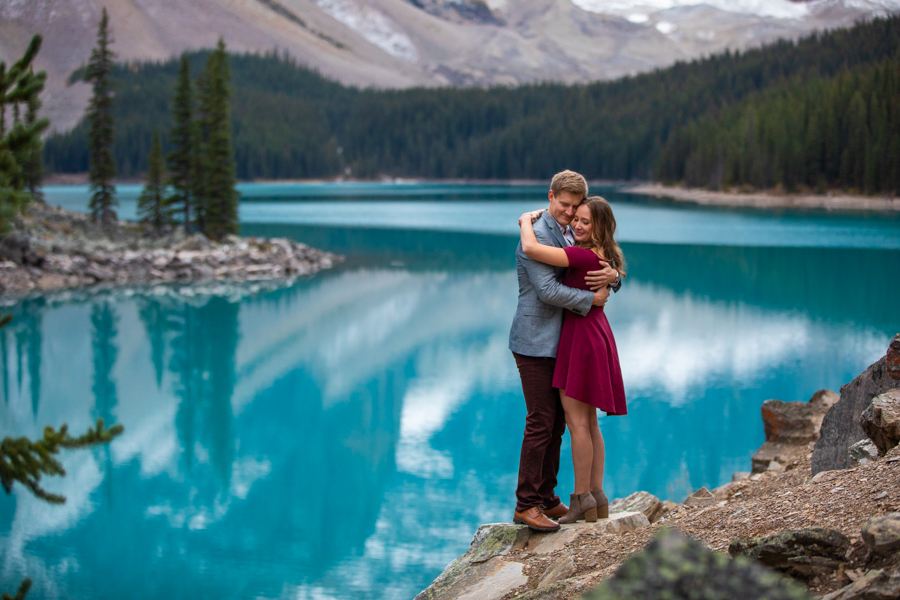 couple cuddling at moraine lake