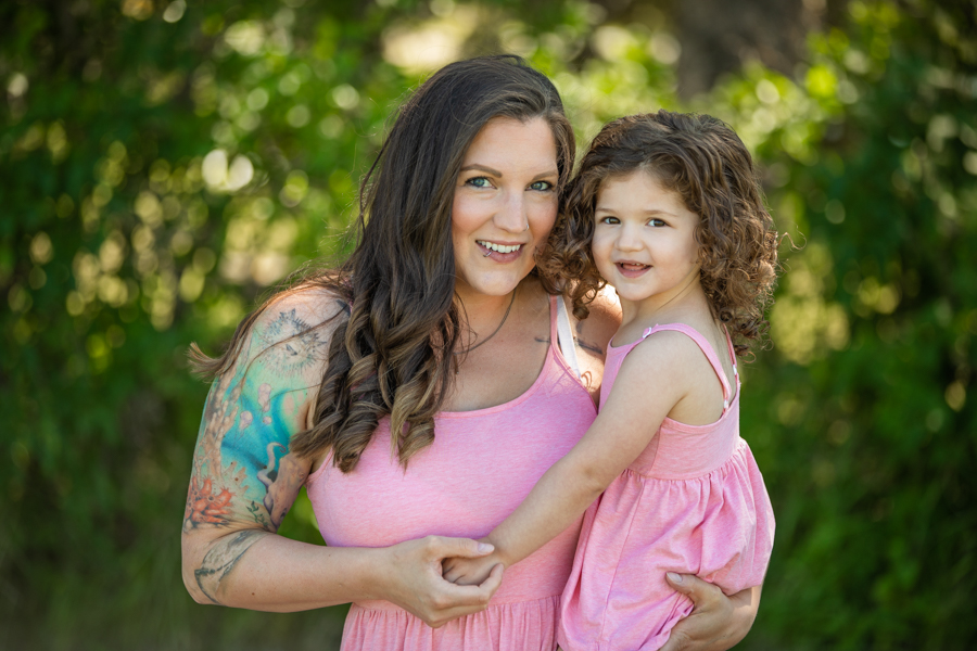 family in pink for photos