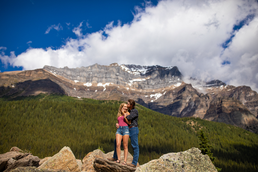 couple standing on the rock mound