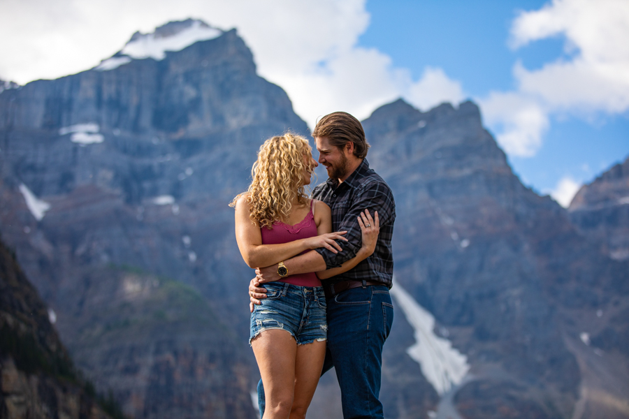 couple cuddling on a rock